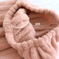Haut de pyjama rose avec col V et fermeture à boutons