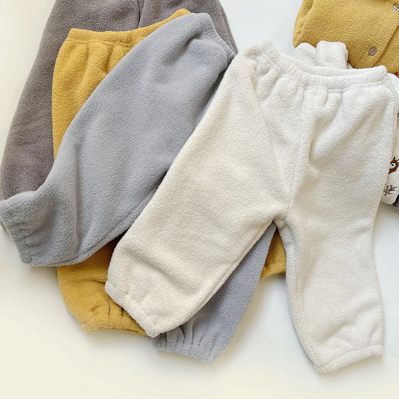 Vue de dos du pyjama gris, élastiques aux chevilles