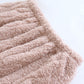 Détail des poches du pyjama rose en matière torsadée