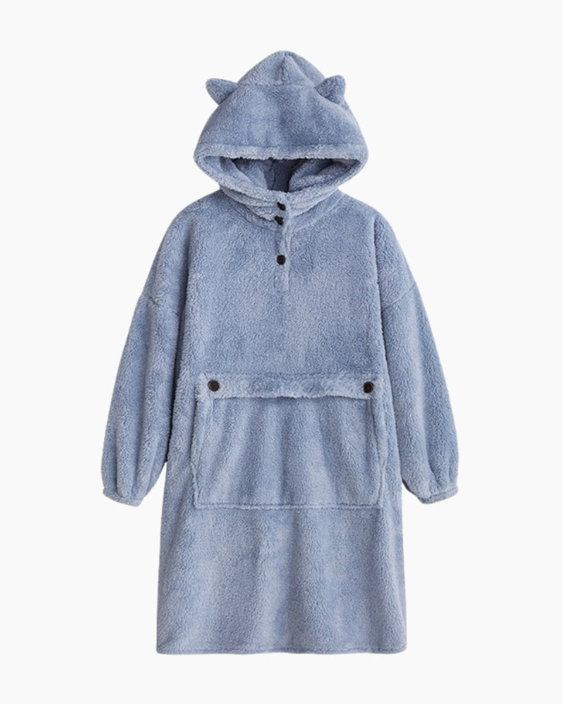 Détail de la poche centrale sur une robe de chambre polaire