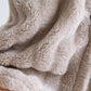 Détail du matelassage et des poches sur la robe de chambre