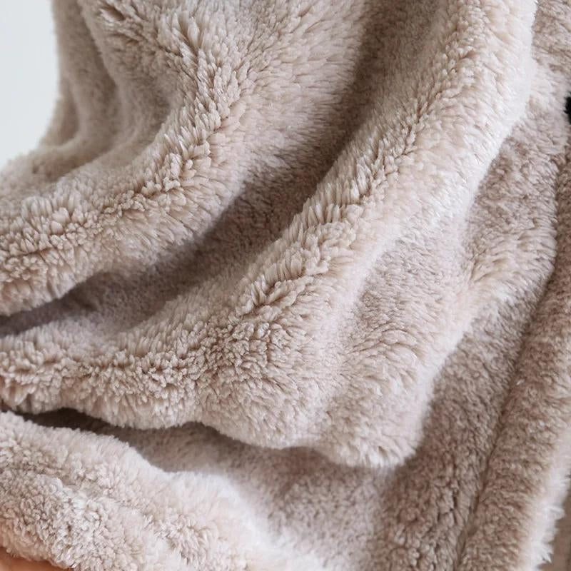 Détail du matelassage et des poches sur la robe de chambre