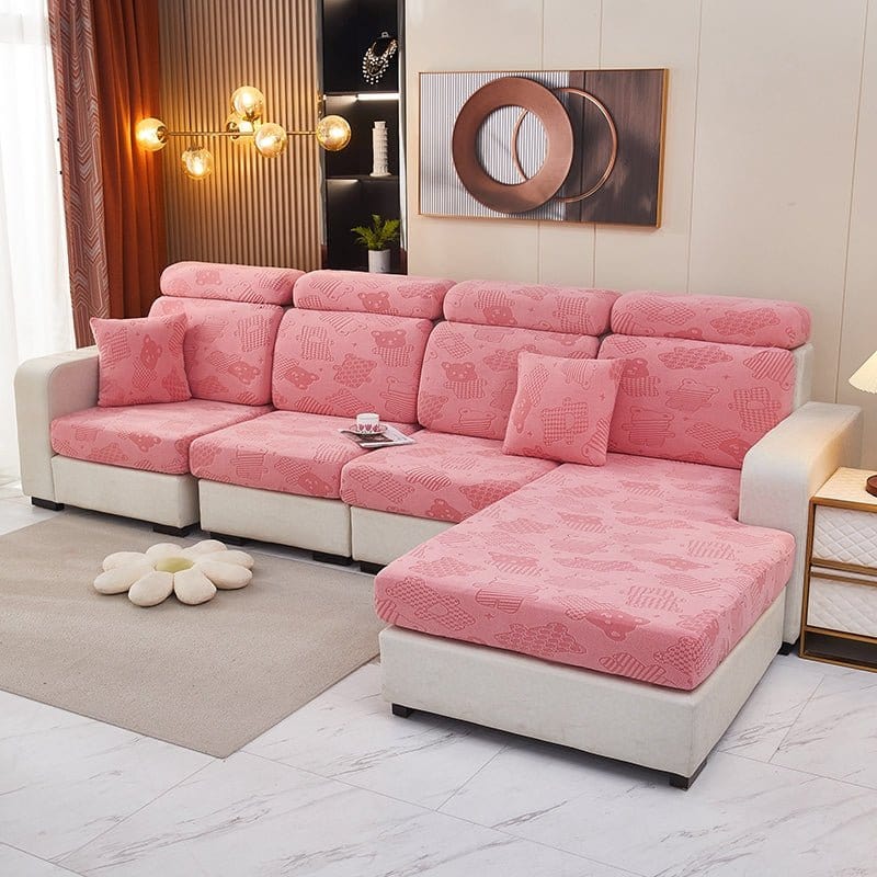 Housse polaire rose avec motif ours sur canapé