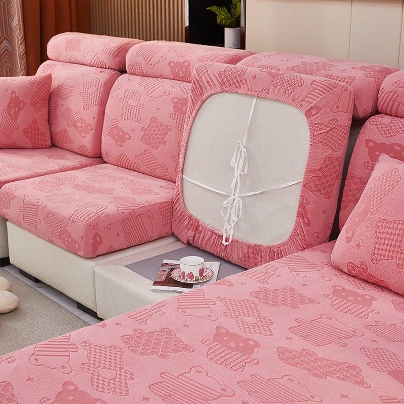 Housse polaire rose couvrant un coussin d'assise