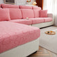 Housse polaire rose, motif floral, installée sur un canapé