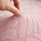 Housse polaire rose avec motif palmier sur coussin de canapé