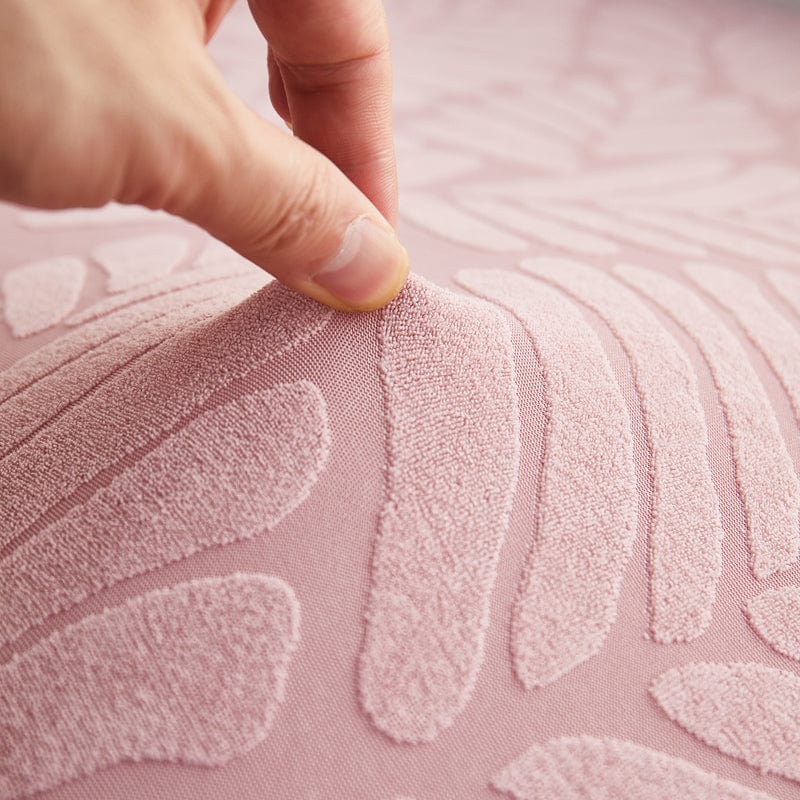Housse polaire rose avec motif palmier sur coussin de canapé