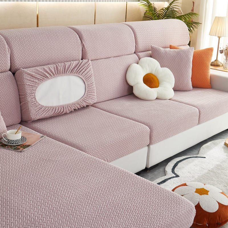 Housse polaire rose pâle couvrant un coussin