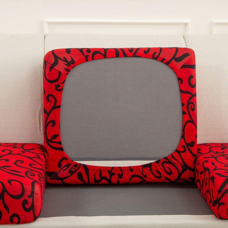 Housse rouge extensible sur coussin de canapé, design géométrique
