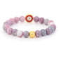 Ensemble mala et bracelet en rhodonite sur fond neutre