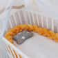 Tour de lit tressé orange en coton doux pour bébé
