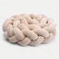Tresse beige flexible s'adaptant à un lit à barreaux