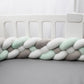 Tresse de lit installée dans un berceau, vue d'ensemble
