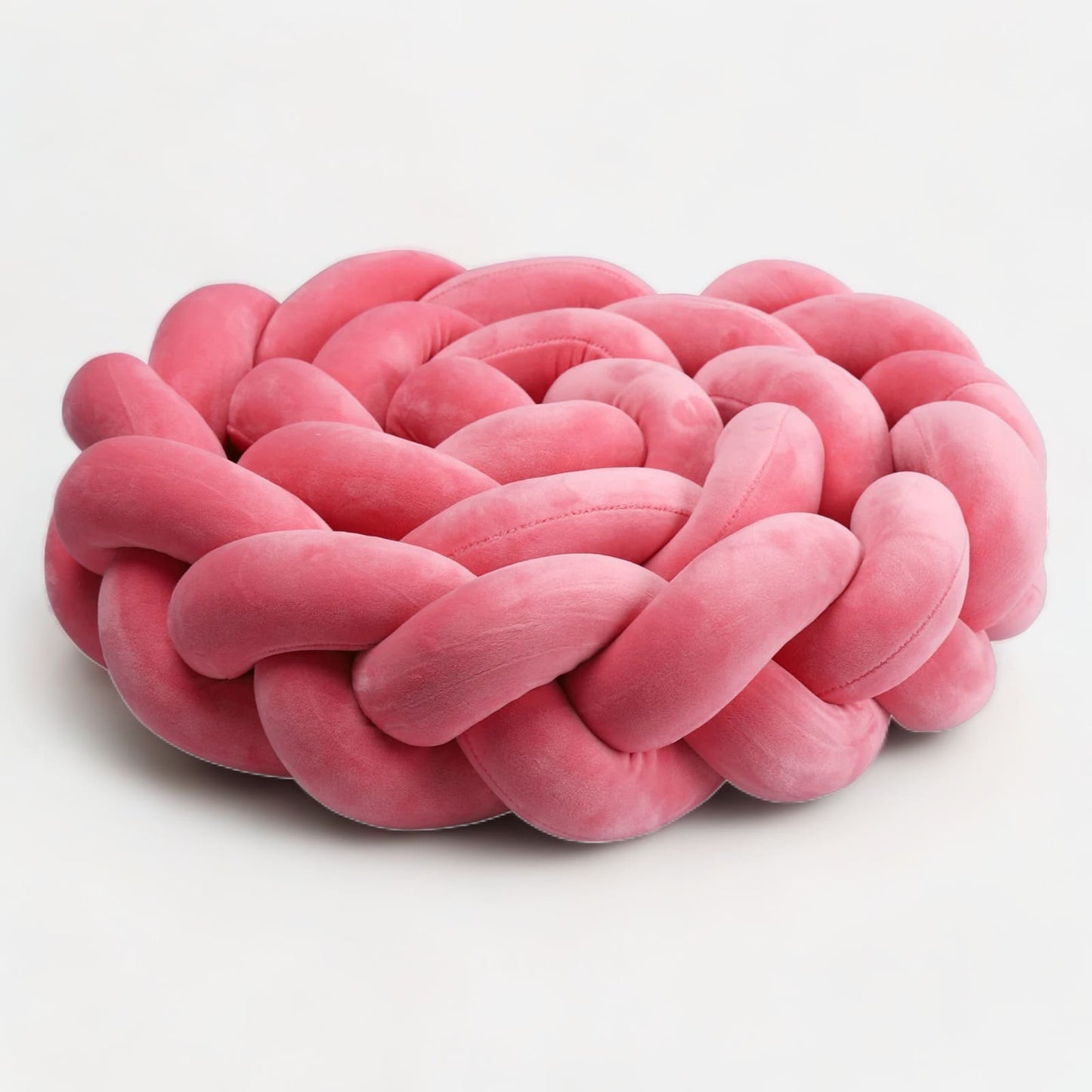 Tresse de lit rose enroulée, montrant sa flexibilité