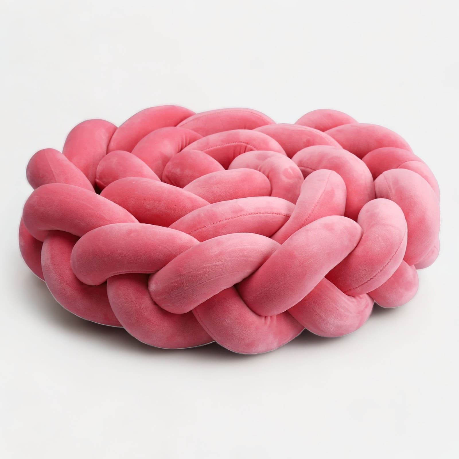 Tresse de lit rose enroulée, montrant sa flexibilité