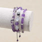 Trio de bracelets en améthyste, opale et hématite sur fond blanc