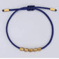 Bracelet bleu avec perles, favorisant l'équilibre émotionnel