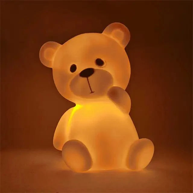 Veilleuse nounours orange LED sur table en bois