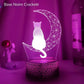 Gros plan sur veilleuse 3D avec chat et lune colorés