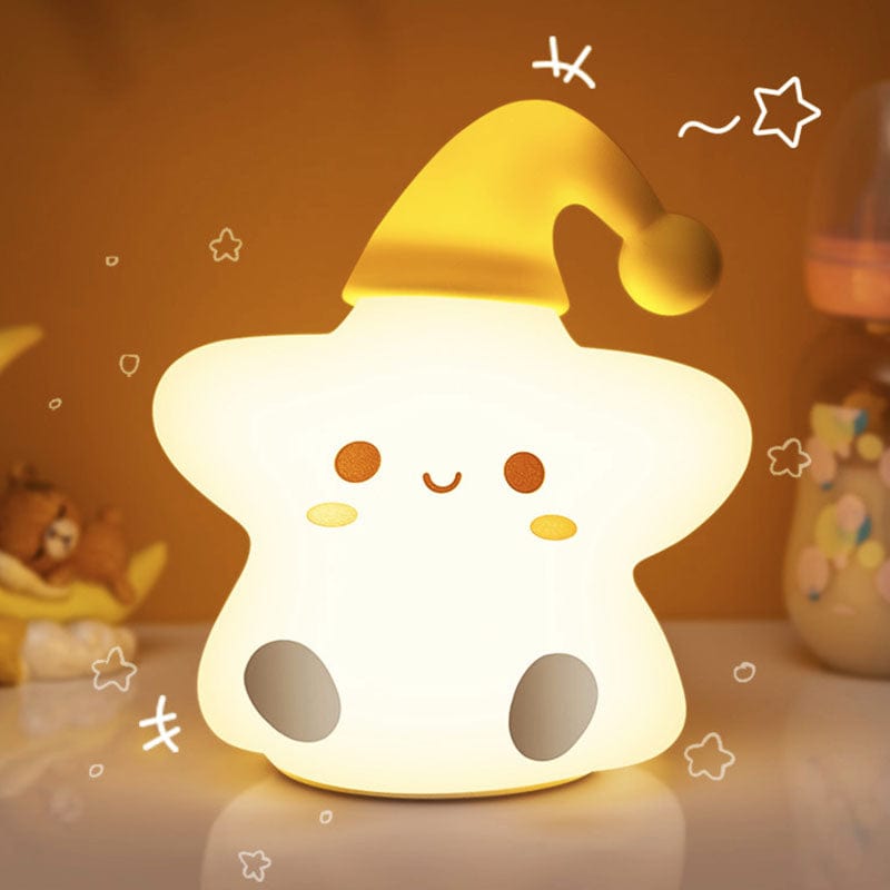 Veilleuse étoile LED posée sur une étagère décorative