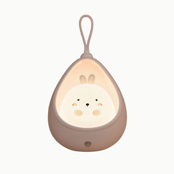 Veilleuse lapin blanche avec lumière douce allumée