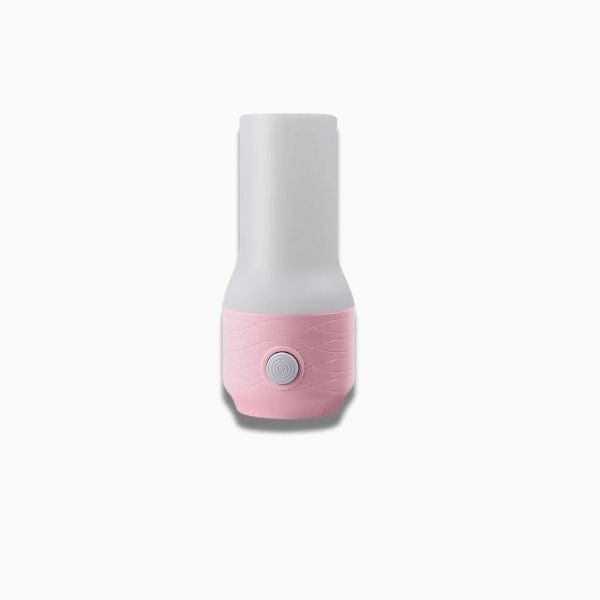 Gros plan sur la veilleuse rose émettant une lumière douce