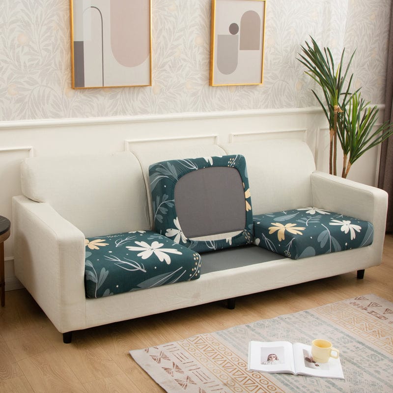 Housse de coussin verte à motif floral sur canapé