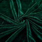 Texture velours vert, brillance subtile sur coussin