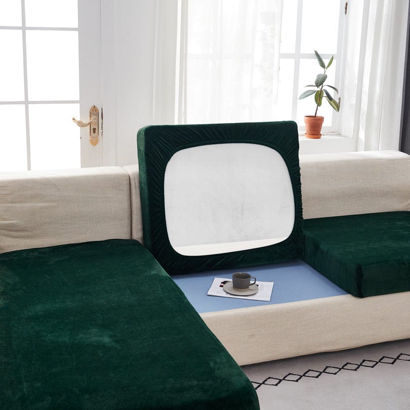 Détail de la housse en velours vert, couture visible