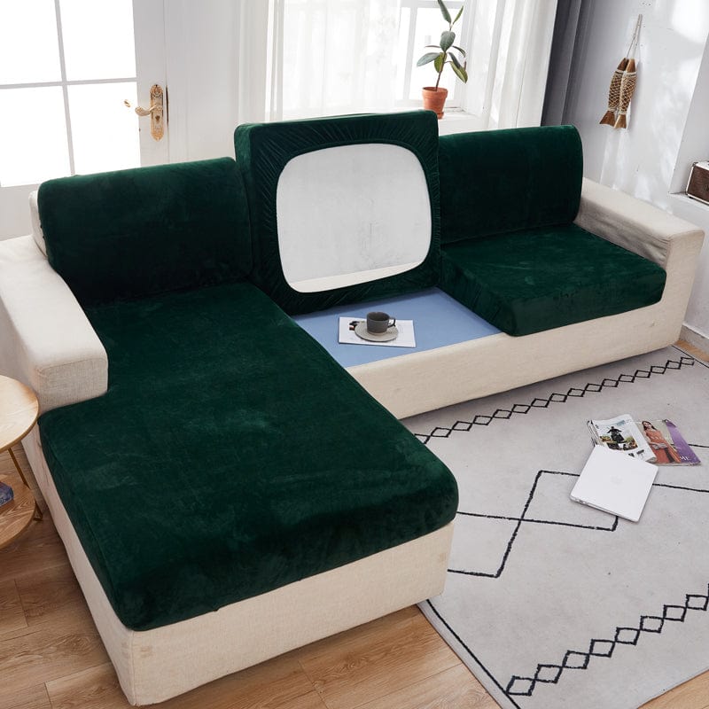 Vue d'ensemble d'un canapé avec housse en velours vert