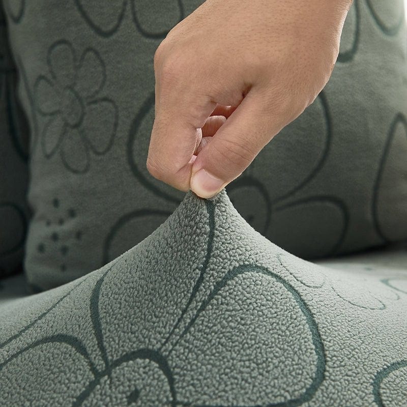 Housse polaire verte avec motif floral sur coussin de canapé
