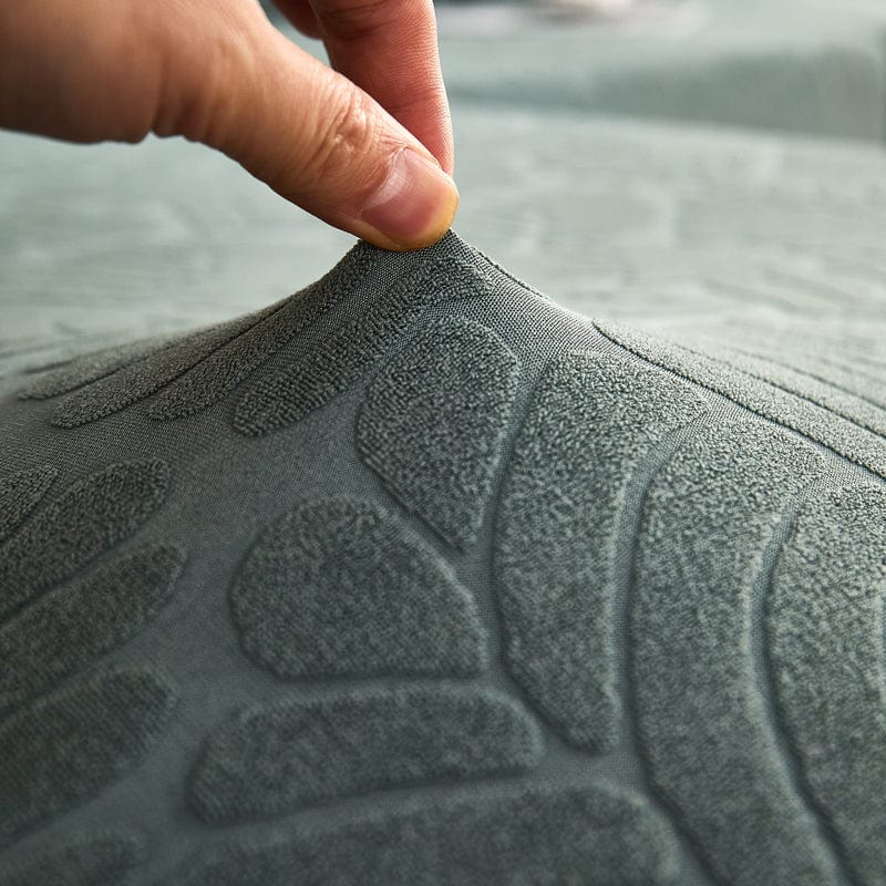 Housse polaire verte avec motif palmier sur coussin de canapé