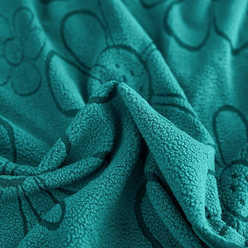 Texture moelleuse de la housse polaire verte en gros plan