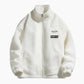 Veste blanche avec fermeture éclair, design épuré