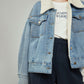 Veste en jean ouverte montrant l'intérieur douillet
