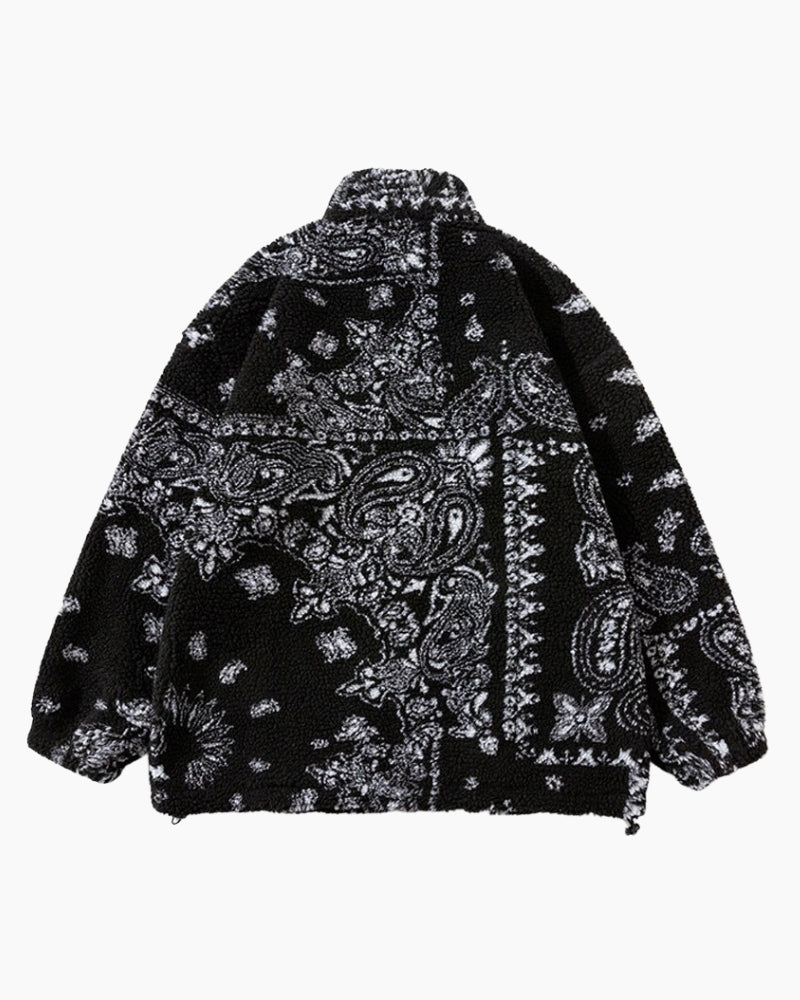 Vue de face d'une veste noire en peluche avec fermeture éclair