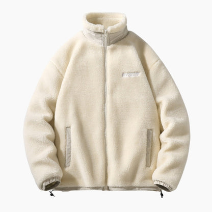 Détail de la veste beige, fermeture éclair et poignets élastiques