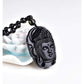 Détails fins du visage de Bouddha sur pendentif en pierre