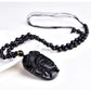 Vue latérale du pendentif Bouddha en obsidienne noire