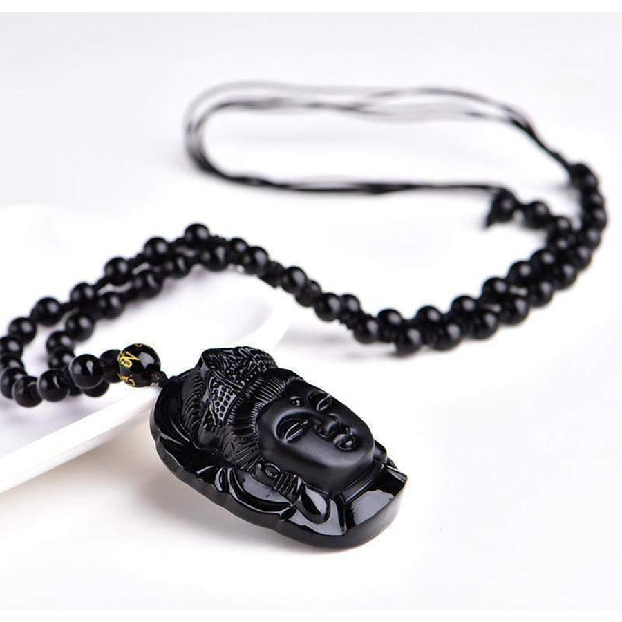 Vue latérale du pendentif Bouddha en obsidienne noire
